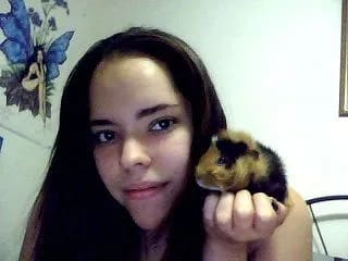 Ali Sanchez with a guinea pig on her shoulder